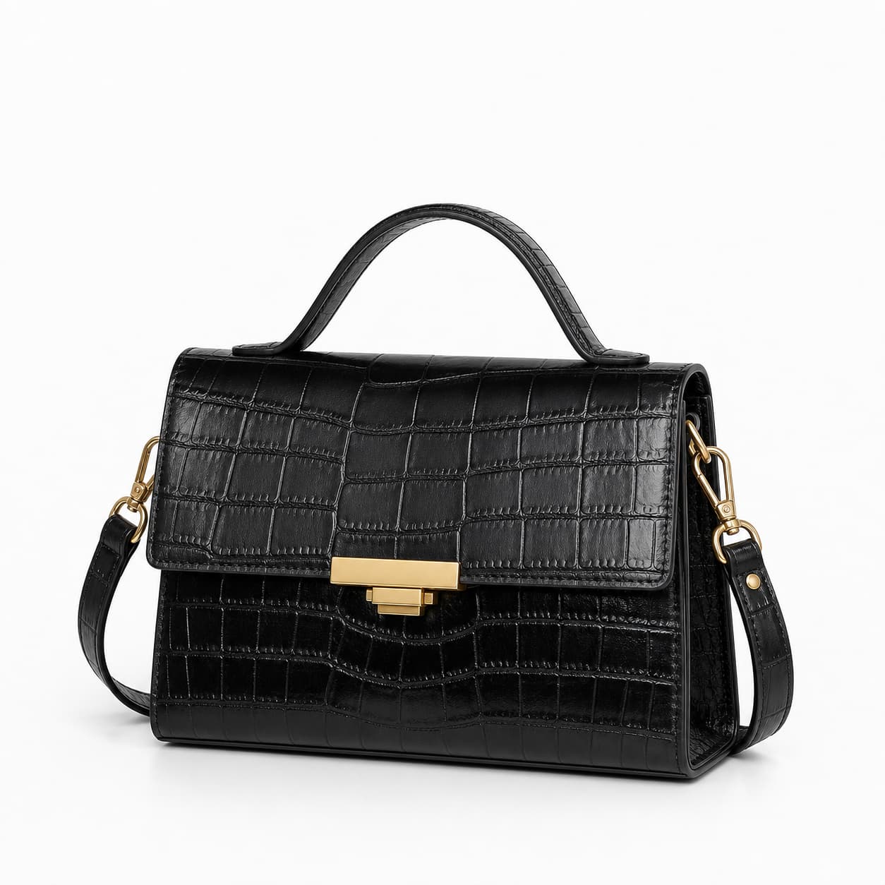 Sac à main Lancaster Paris Ily en cuir noir, avec silhouette structurée et détails dorés, sur fond blanc minimaliste.